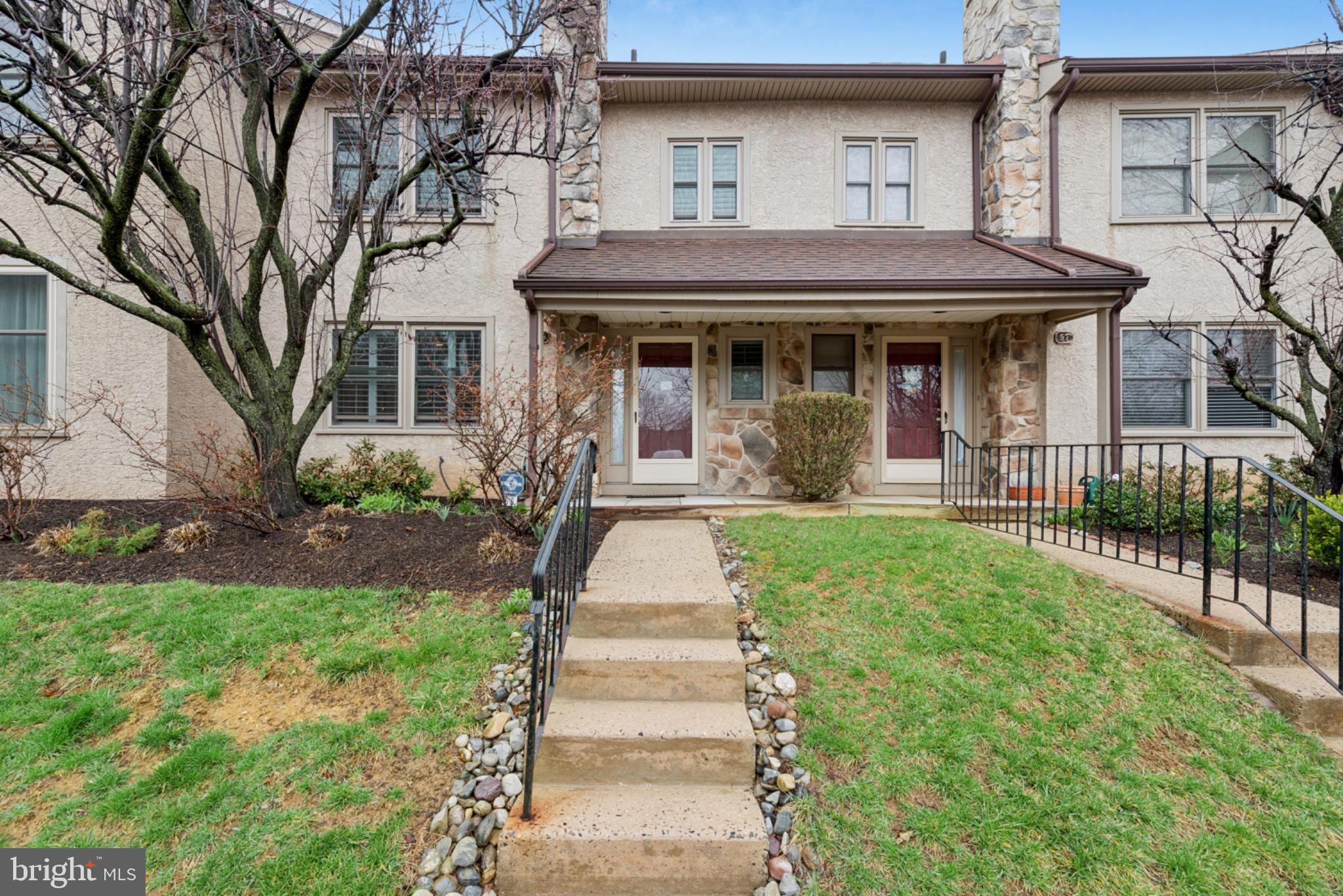 Charming townhouse with inviting entrance.