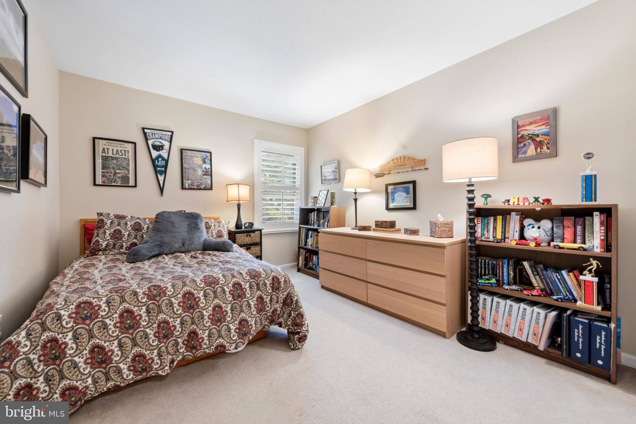 56 Woodstream Drive Chesterbrook, PA 19087 - Photo 18 of 34 Cozy bedroom with warm lighting.