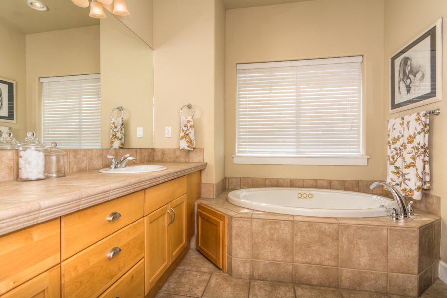 2159 Southwest 36th Court Redmond, OR 97756 - Photo 26 of 44 Master 5 piece en suite includes tiled shower, soaking tub, enclosed W/C and large walk-in closet.