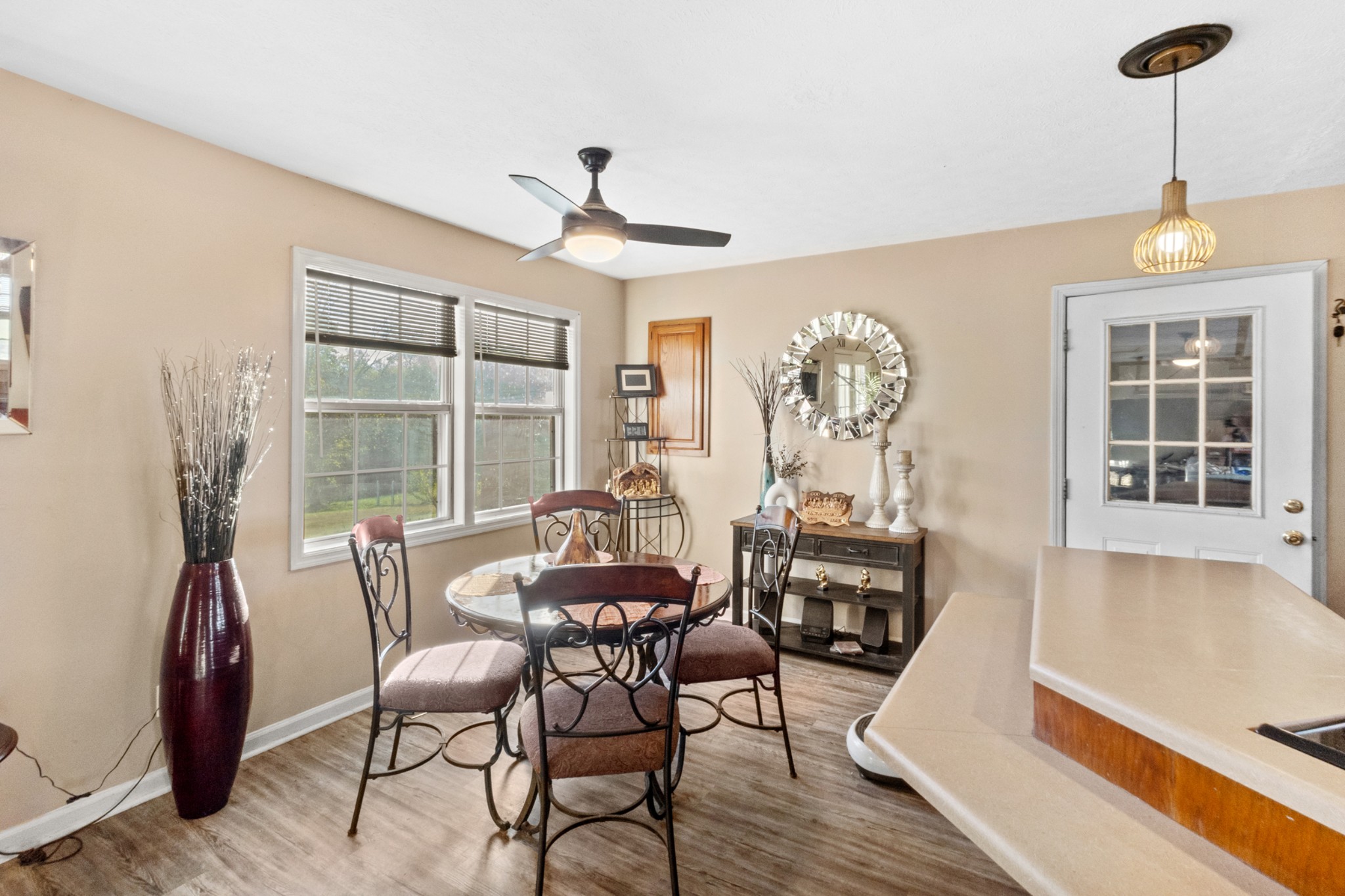 580 Gregory Road Westmoreland, TN 37186 - Photo 13 of 45 a view of a dining room with furniture window and wooden floor