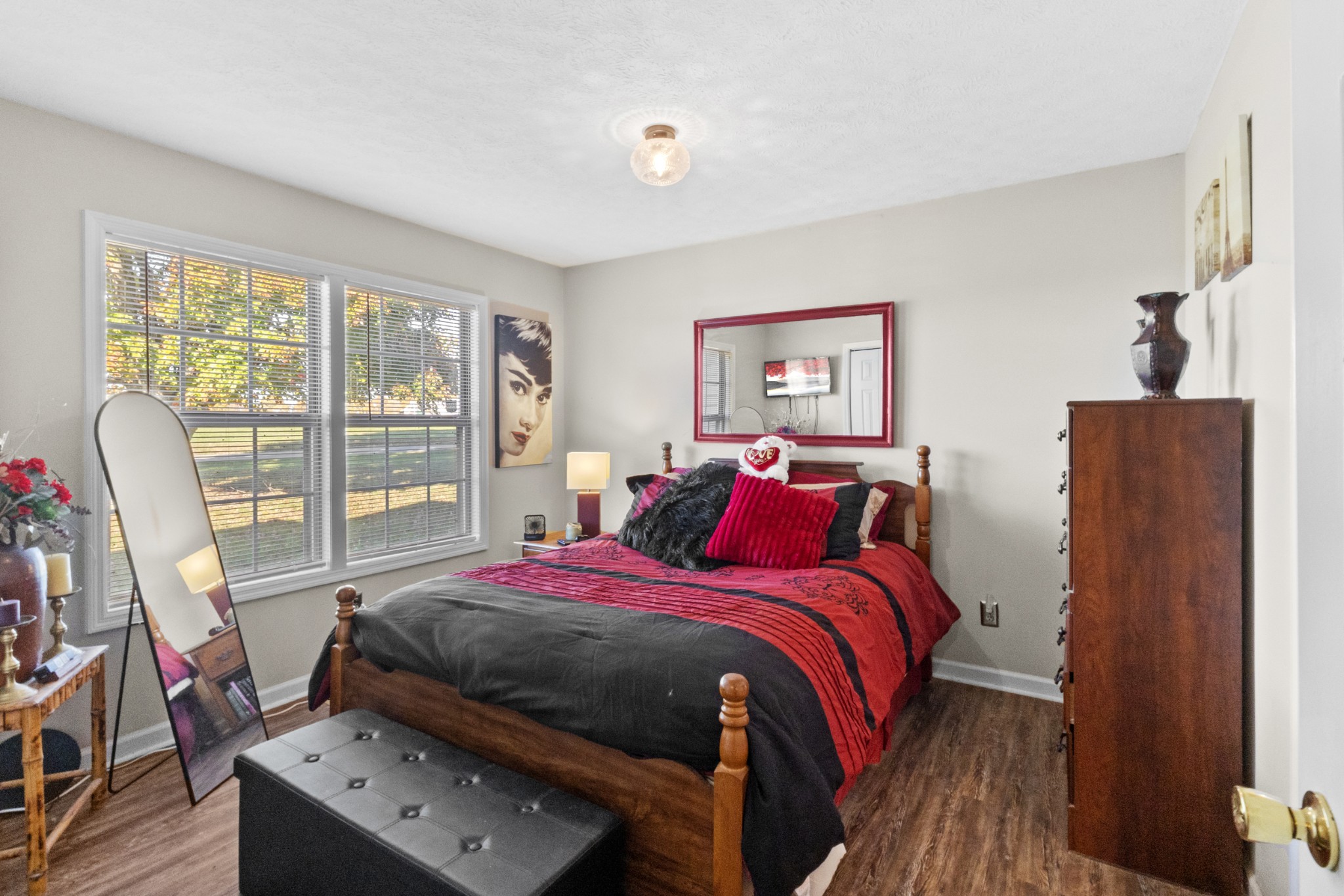 580 Gregory Road Westmoreland, TN 37186 - Photo 20 of 45 a bedroom with a bed and wooden floor