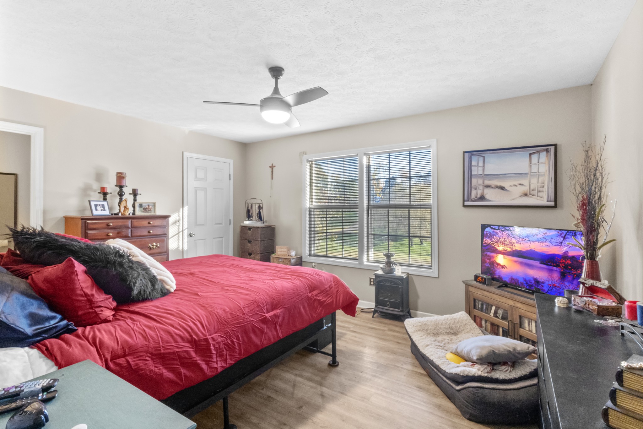 580 Gregory Road Westmoreland, TN 37186 - Photo 26 of 45 a bedroom with a bed and glass window