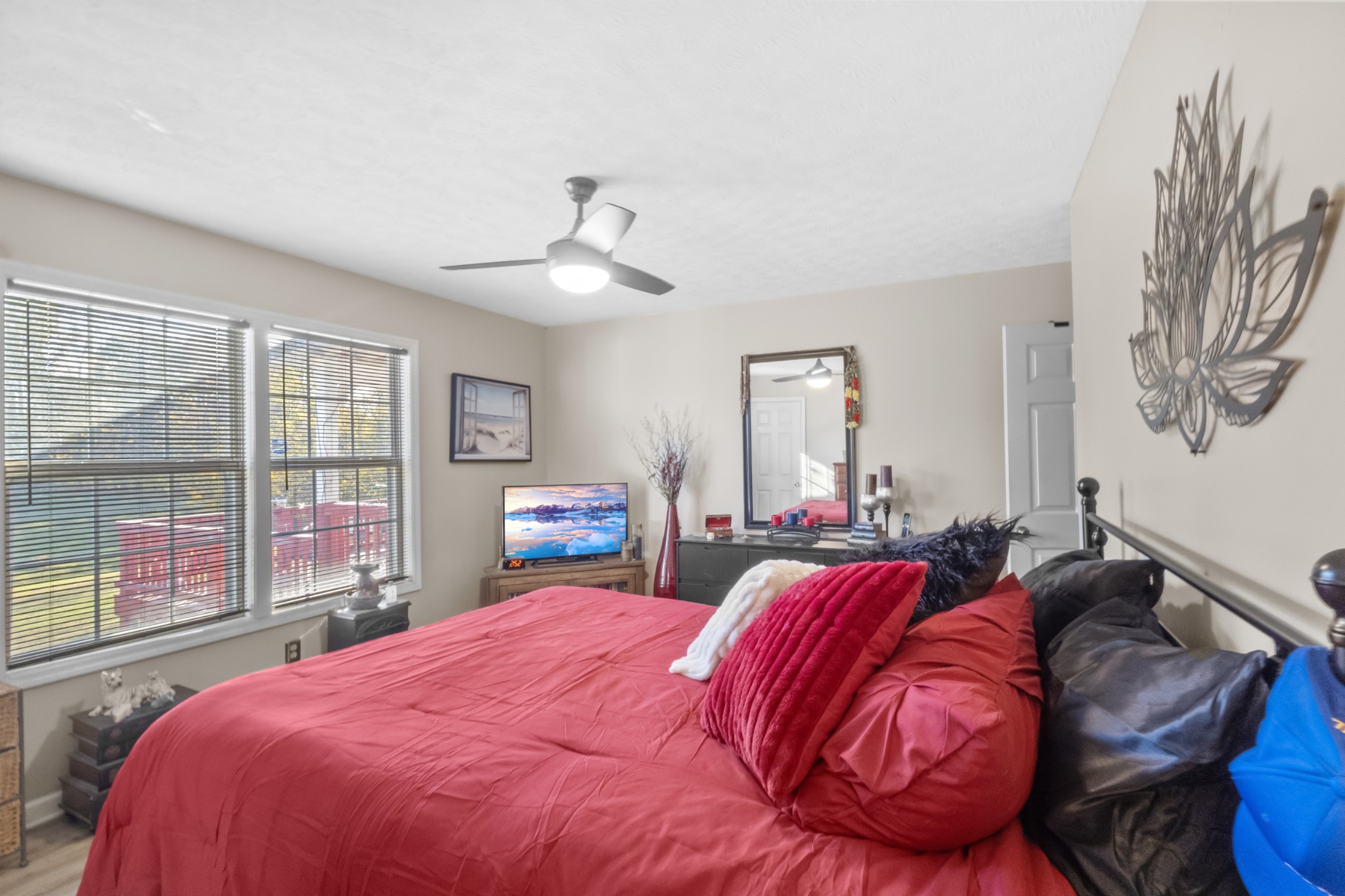 580 Gregory Road Westmoreland, TN 37186 - Photo 27 of 45 a bed sitting in a bedroom next to a window