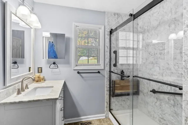 a en suite bathroom with a toilet sink and mirror