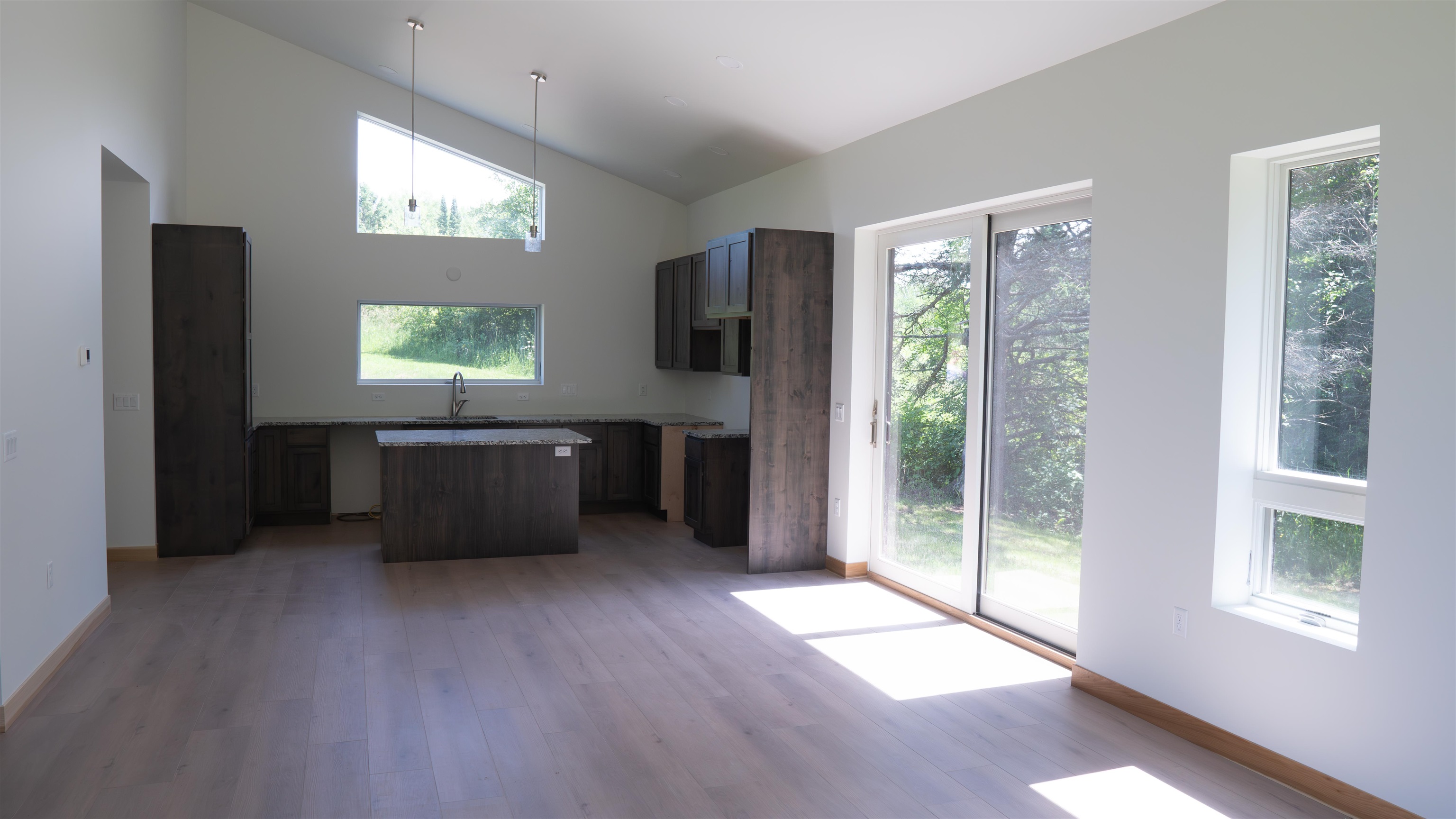 23190 Sawgrass Road Cornucopia, WI 54827 - Photo 11 of 23 Kitchen featuring wood-type flooring and plenty of natural light