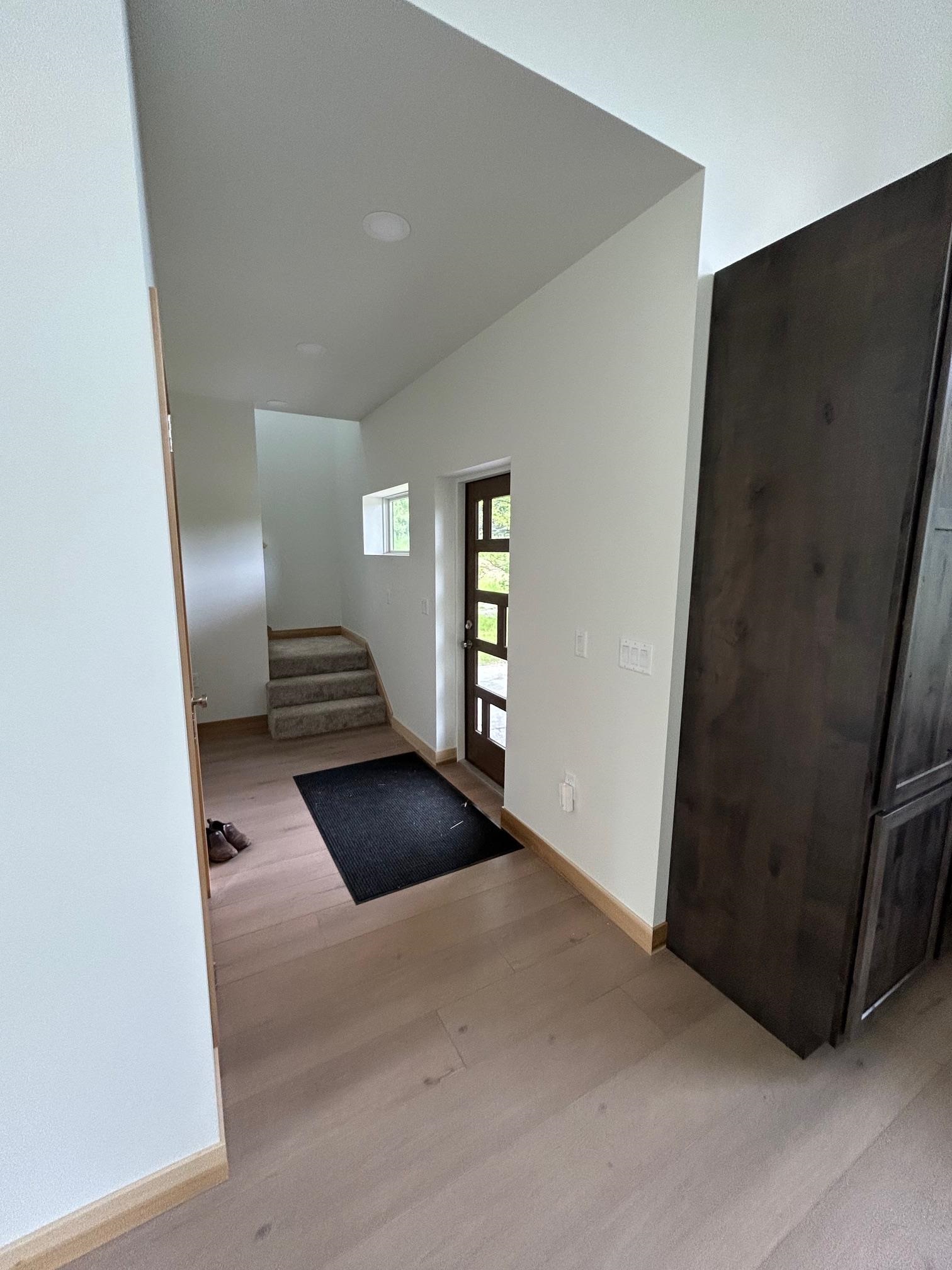 23190 Sawgrass Road Cornucopia, WI 54827 - Photo 8 of 23 Foyer entrance with vaulted ceiling and hardwood / wood-style floors