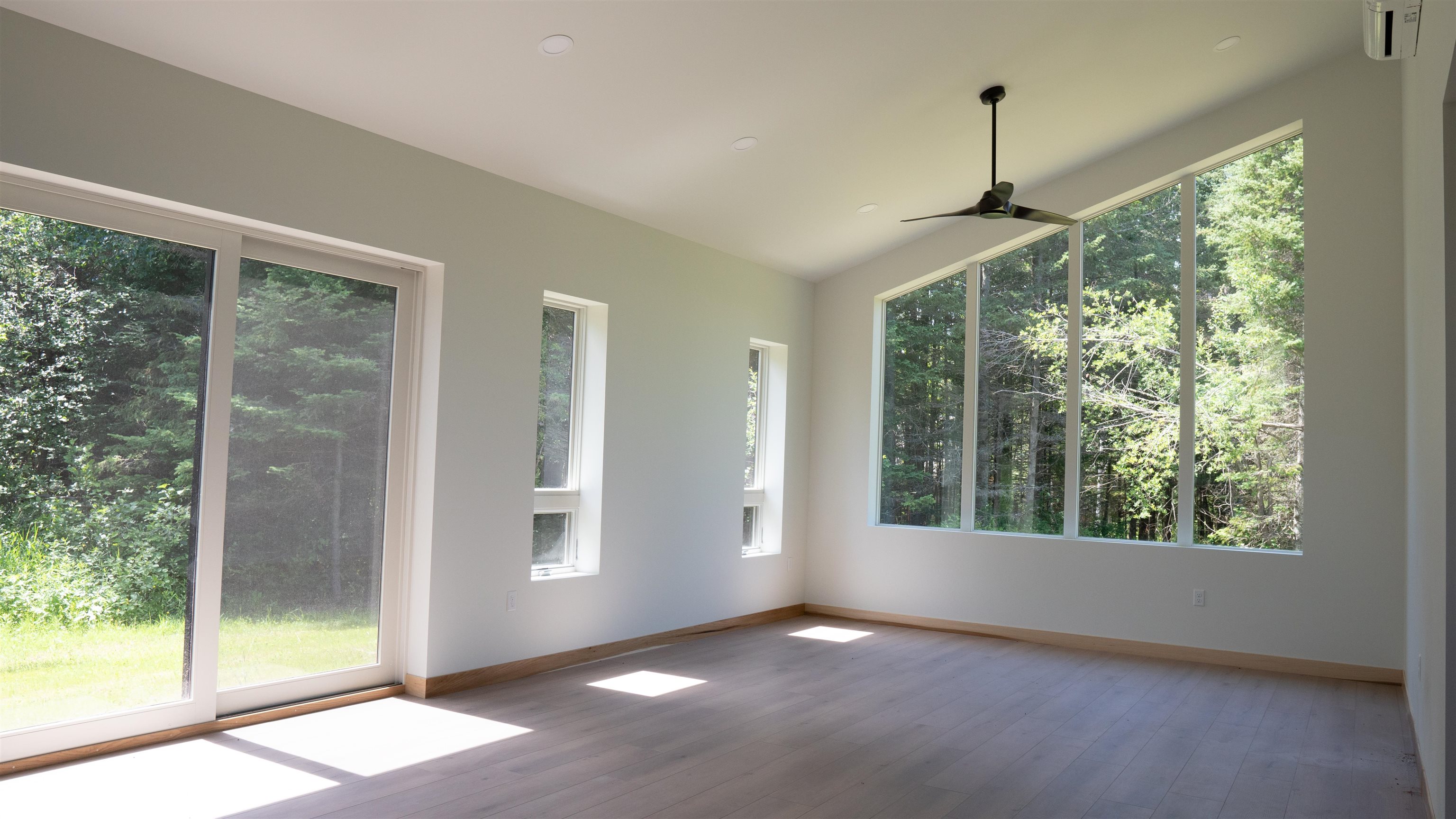 23190 Sawgrass Road Cornucopia, WI 54827 - Photo 9 of 23 Unfurnished sunroom featuring plenty of natural light and ceiling fan