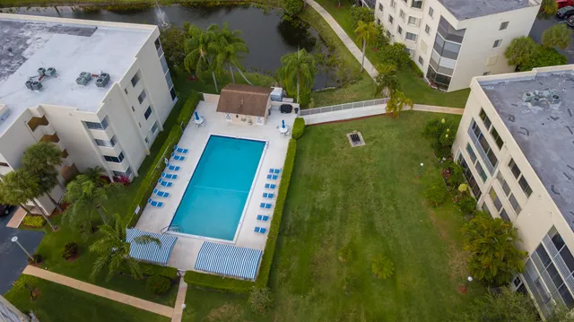 a living room with furniture a rug and a window