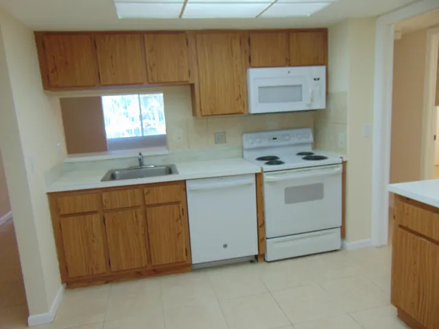 a utility room with sink dryer and washer