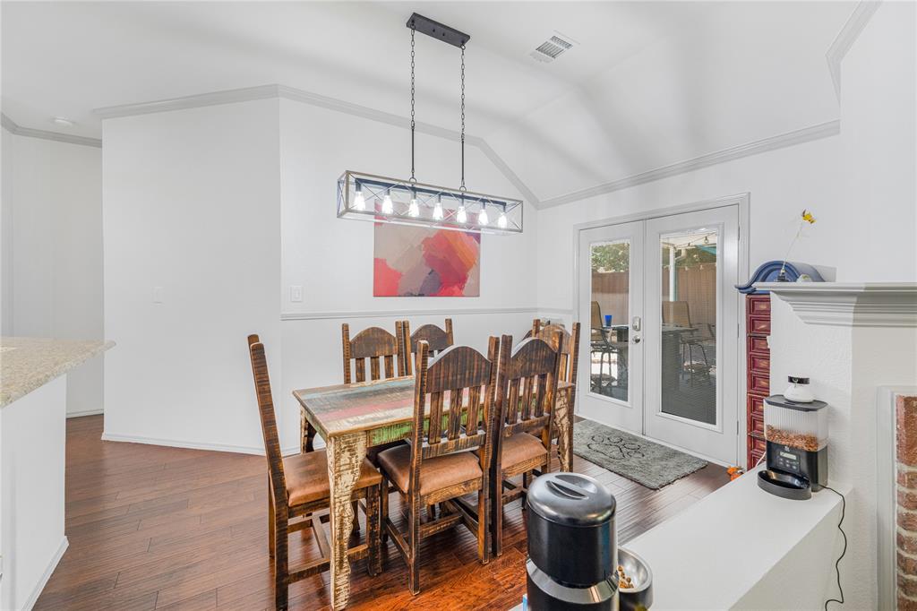 2813 Ridgemere Drive Flower Mound, TX 75028 - Photo 6 of 18 a dining room with furniture and wooden floor