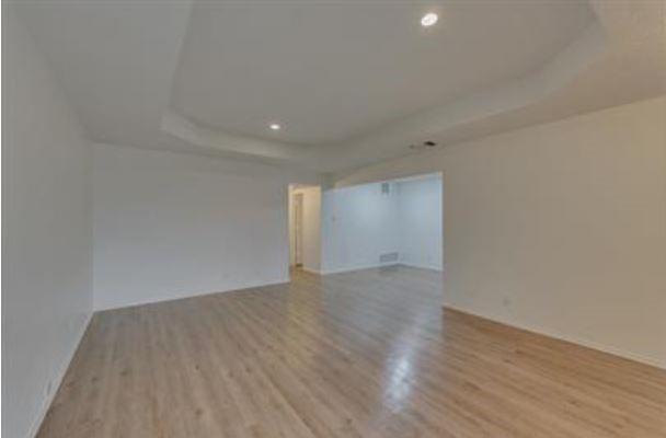 1817 San Rafael Street, Unit 1 Fort Worth, TX 76134 - Photo 4 of 15 a view of an empty room with wooden floor
