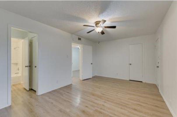 1817 San Rafael Street, Unit 1 Fort Worth, TX 76134 - Photo 10 of 15 a view of an empty room with a fan