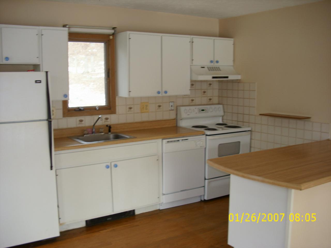 952 Canterbury Road Bushkill, PA 18324 - Photo 8 of 11 a kitchen with granite countertop white cabinets and white appliances
