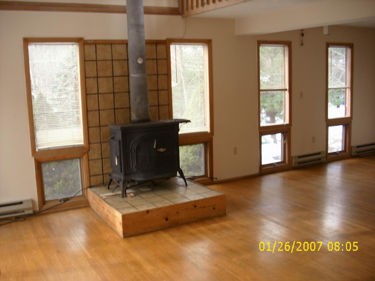 952 Canterbury Road Bushkill, PA 18324 - Photo 9 of 11 a living room with hard wood floors and a window
