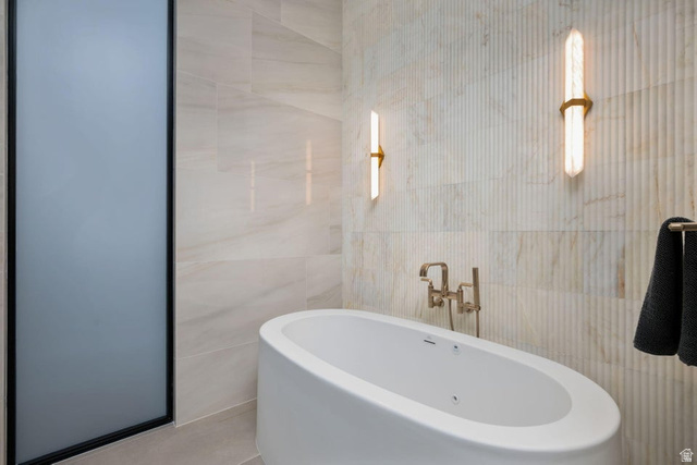 2867 East Granite Way St. George, UT 84790 - Photo 31 of 69 Freestanding oval soaking tub with wall-mounted bronze-finish faucet