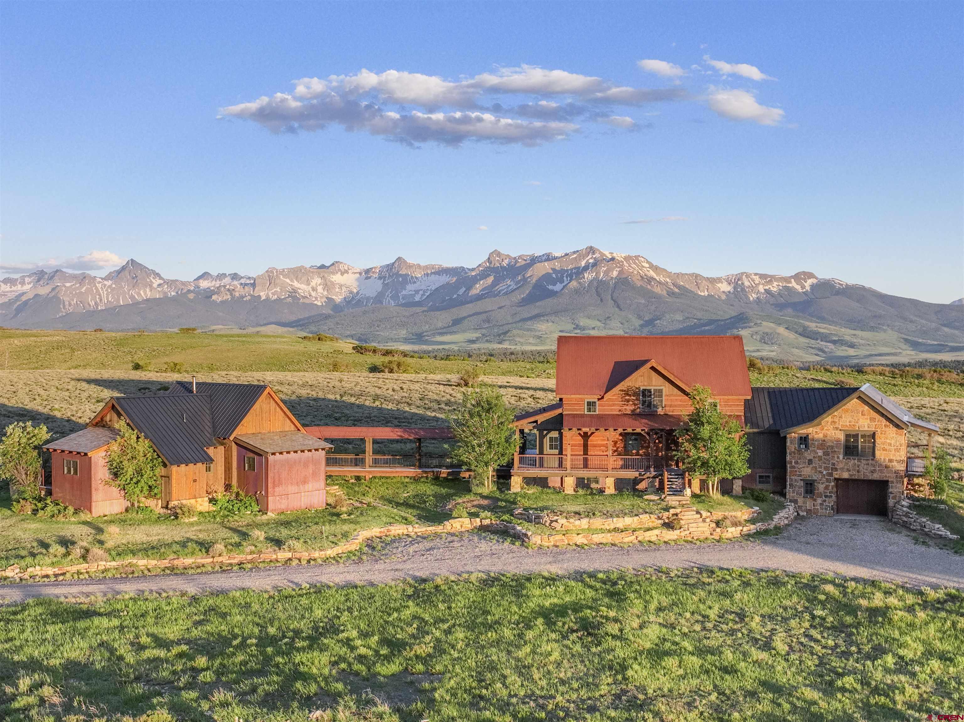 an aerial view of houses with a swimming pool