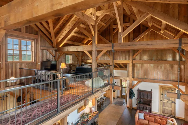 a view of a balcony with two chairs and a table