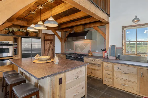 a kitchen with sink and stove