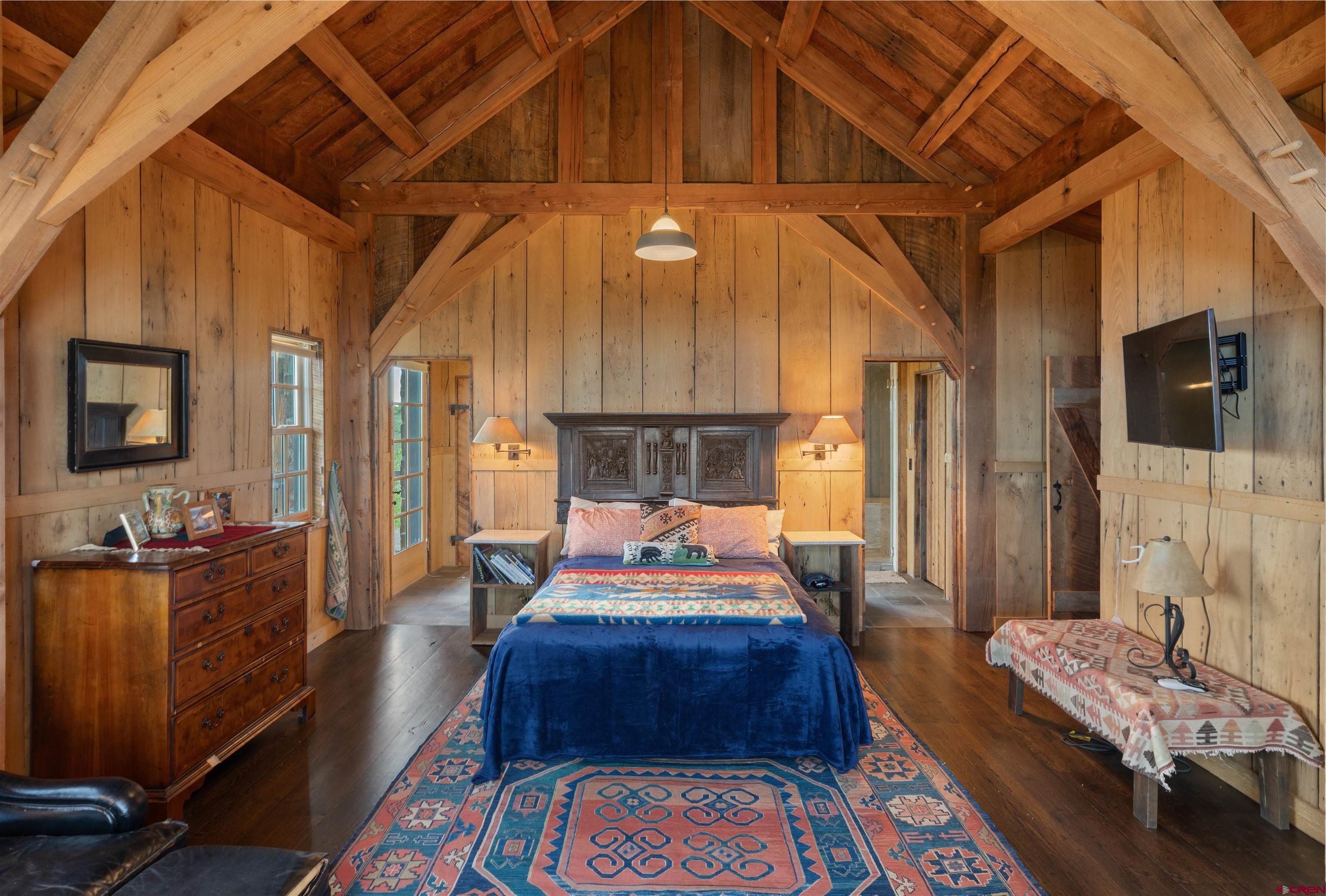 842 Ranch Road Ridgway, CO 81432 - Photo 13 of 35 a living room with furniture and a chandelier