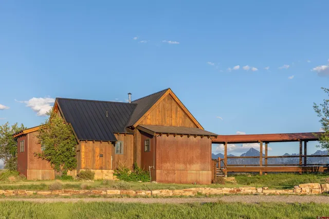 a backyard of a house with yard and swimming pool