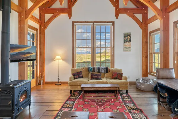 a living room with furniture and a rug