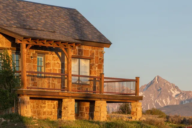 a view of a town with mountains in the background