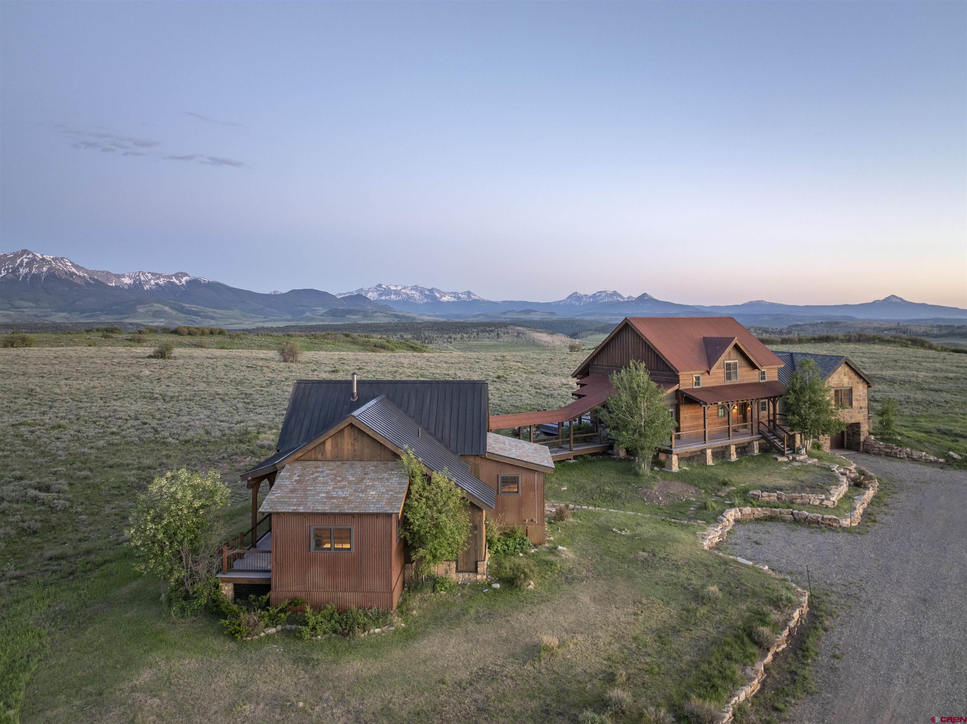 842 Ranch Road Ridgway, CO 81432 - Photo 3 of 35 an aerial view of a house with a yard and a large tree