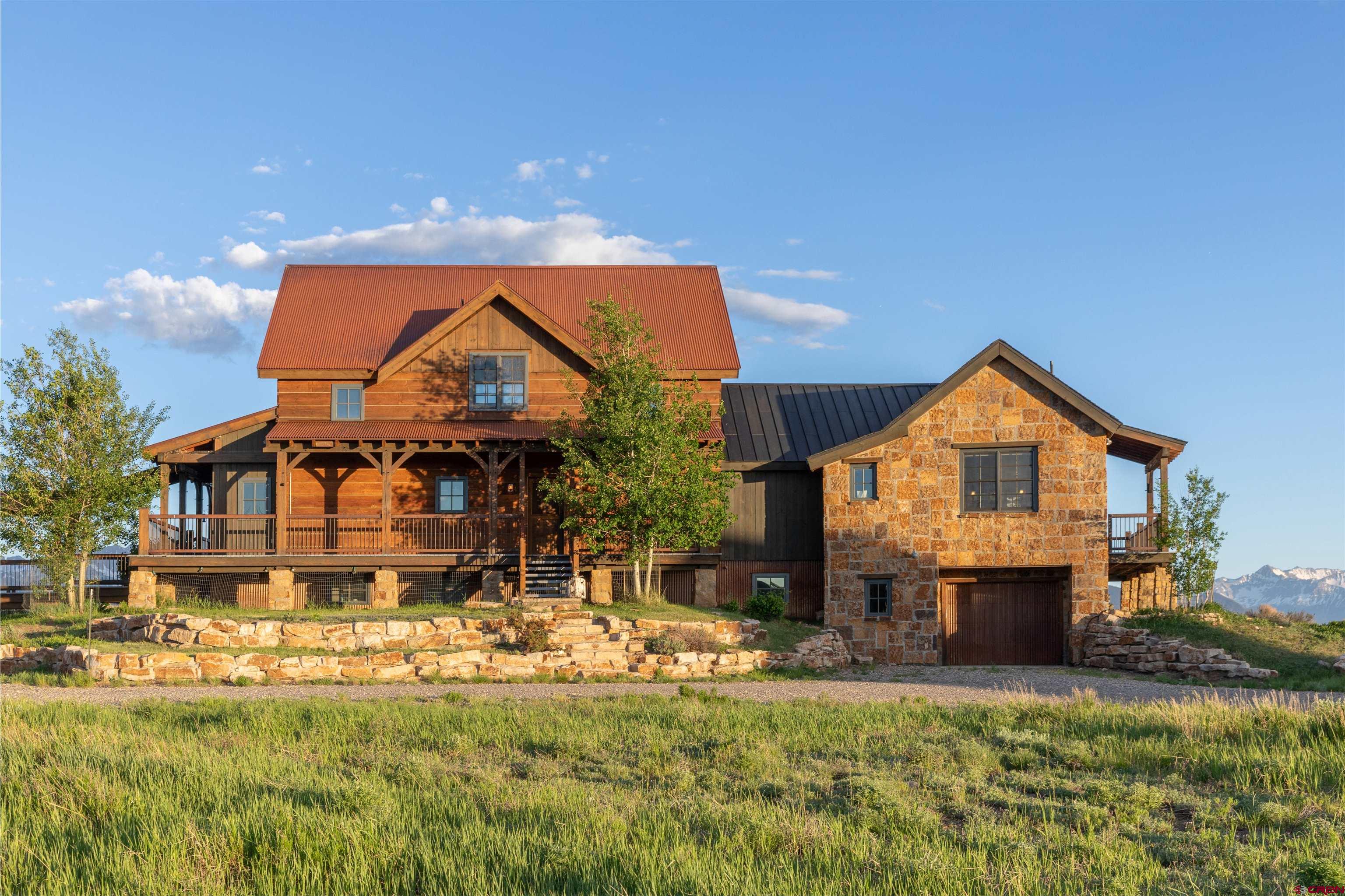 842 Ranch Road Ridgway, CO 81432 - Photo 7 of 35 a front view of a house with a yard