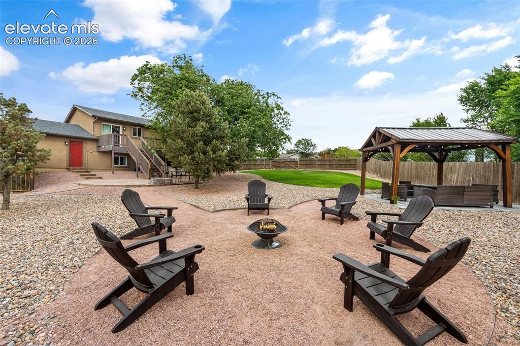 125 Diamond E Road Fountain, CO 80817 - Photo 33 of 43 a view of a backyard with sitting area