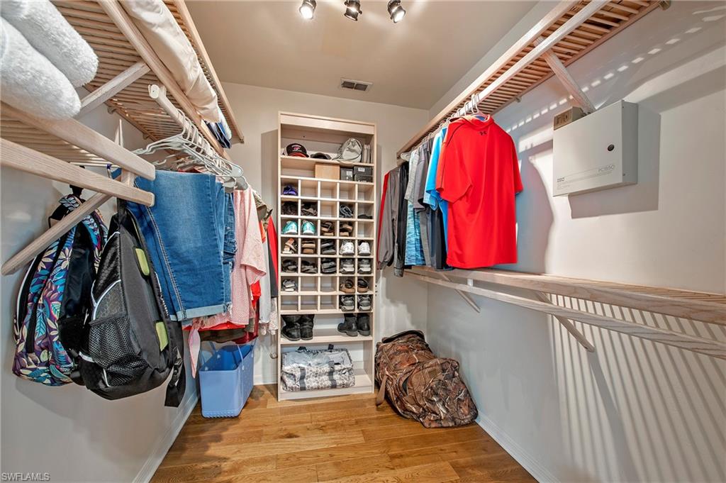 5060 Coldstream Lane Naples, FL 34104 - Photo 18 of 32 Walk-in closet in master bedroom.