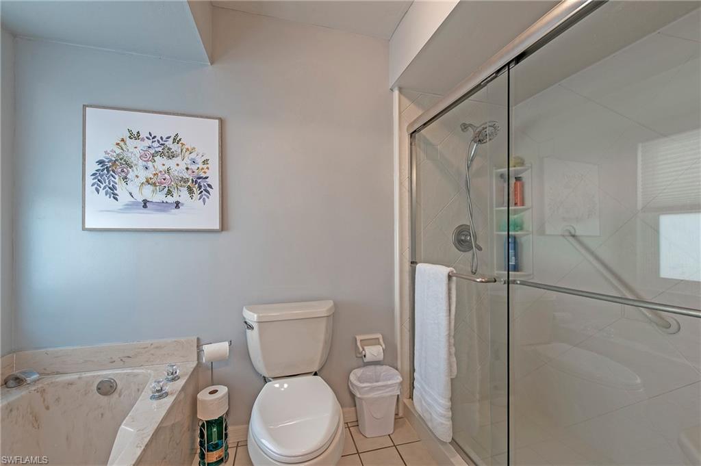 5060 Coldstream Lane Naples, FL 34104 - Photo 19 of 32 Master shower has both soaking tub and separate shower.