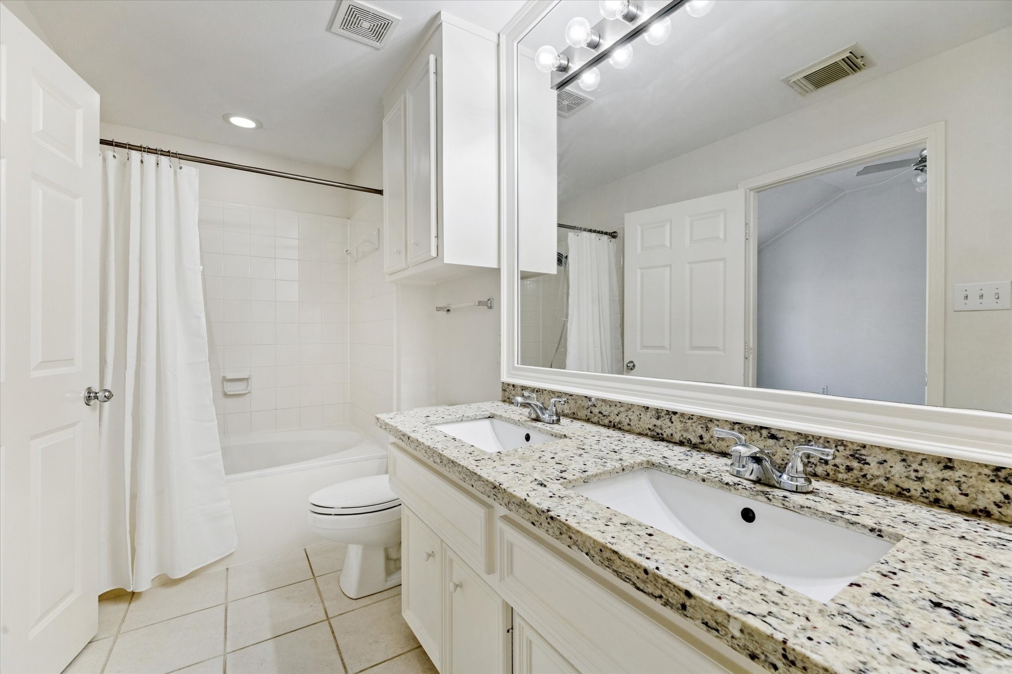 1626 Genesee Street Houston, TX 77006 - Photo 14 of 22 a bathroom with a granite countertop sink a toilet and shower