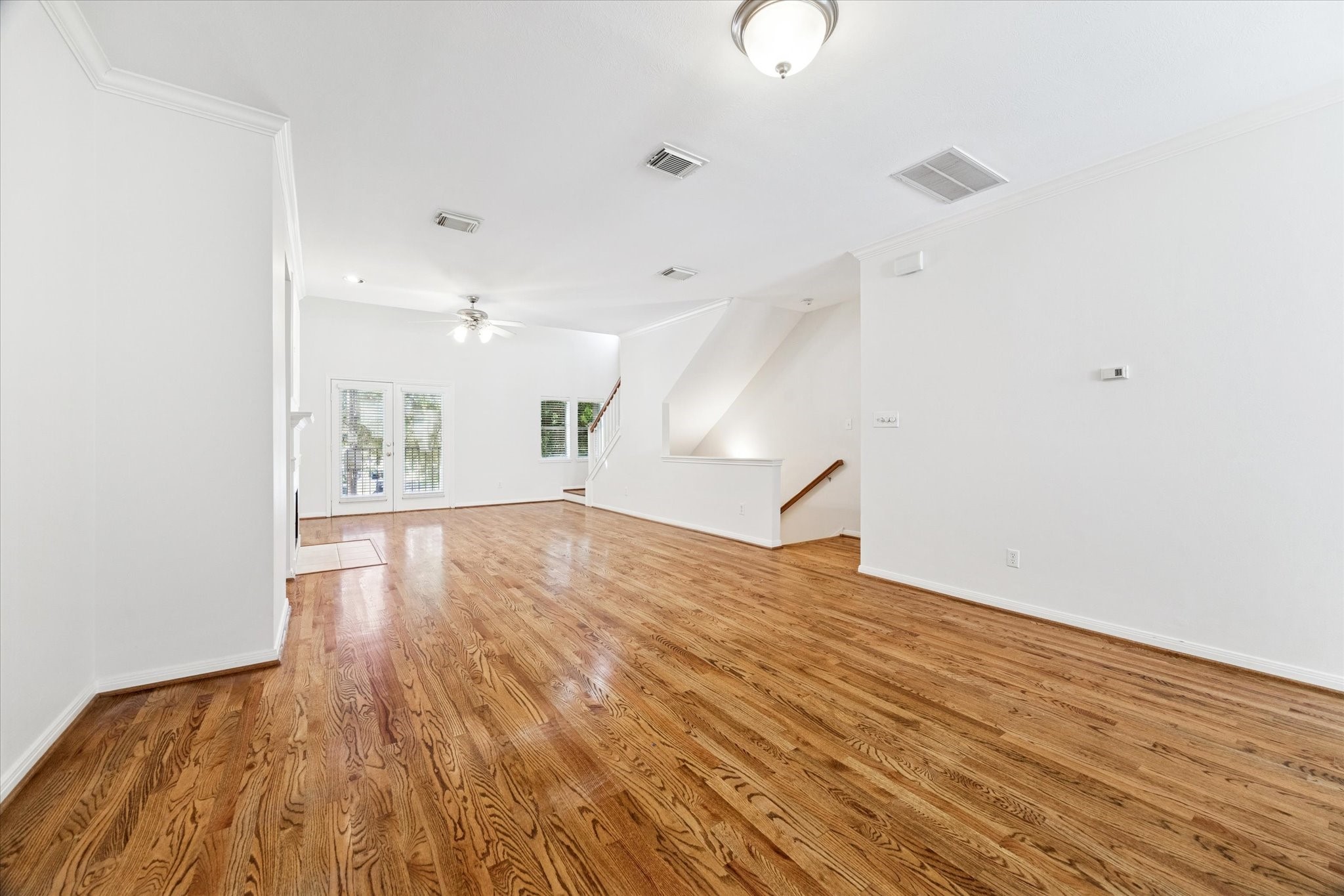 1626 Genesee Street Houston, TX 77006 - Photo 5 of 22 a view of empty room with wooden floor