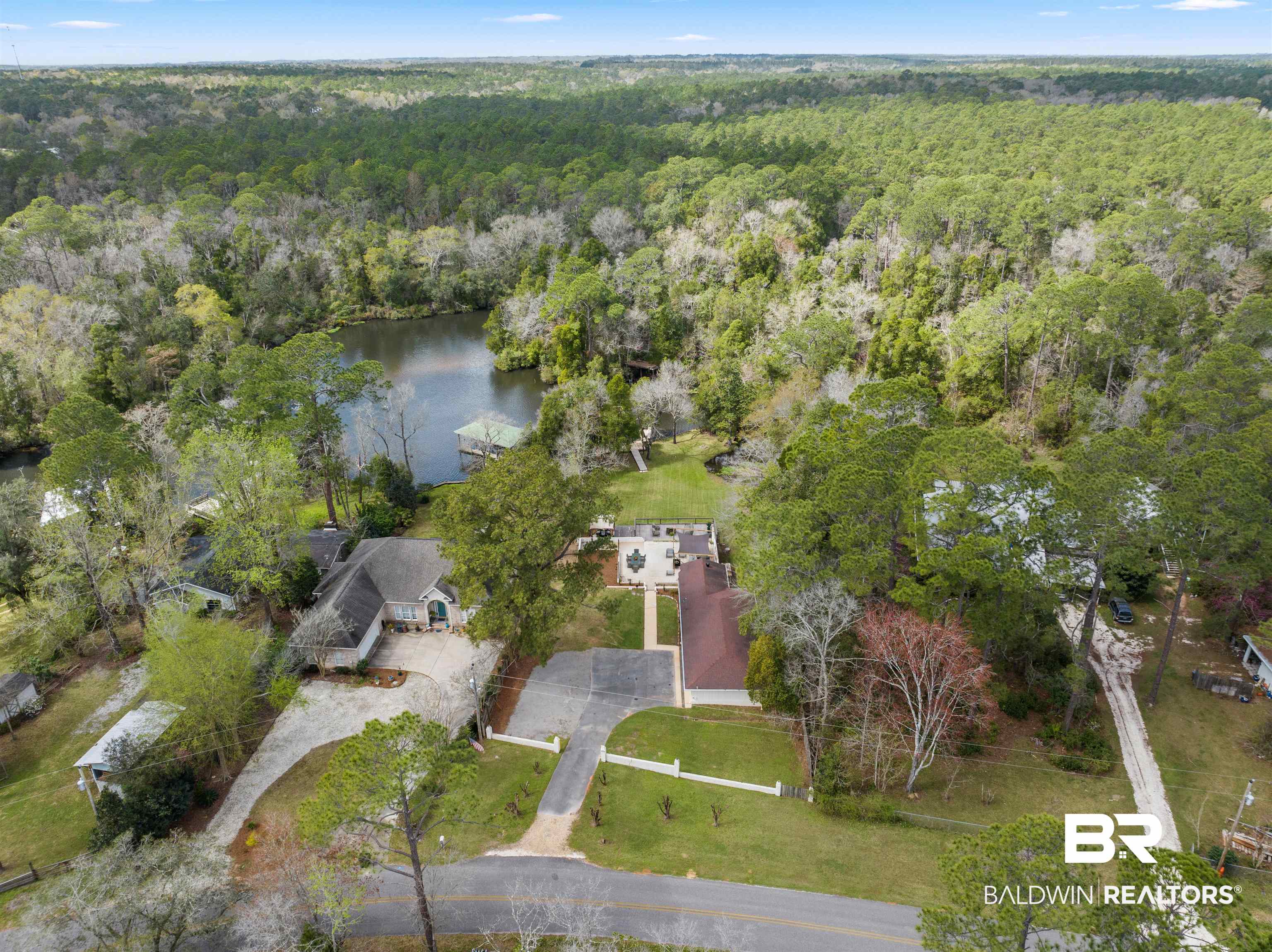17595 River Road Summerdale, AL 36580 - Photo 28 of 29 Bird's eye view of a large body of water and a heavily wooded area
