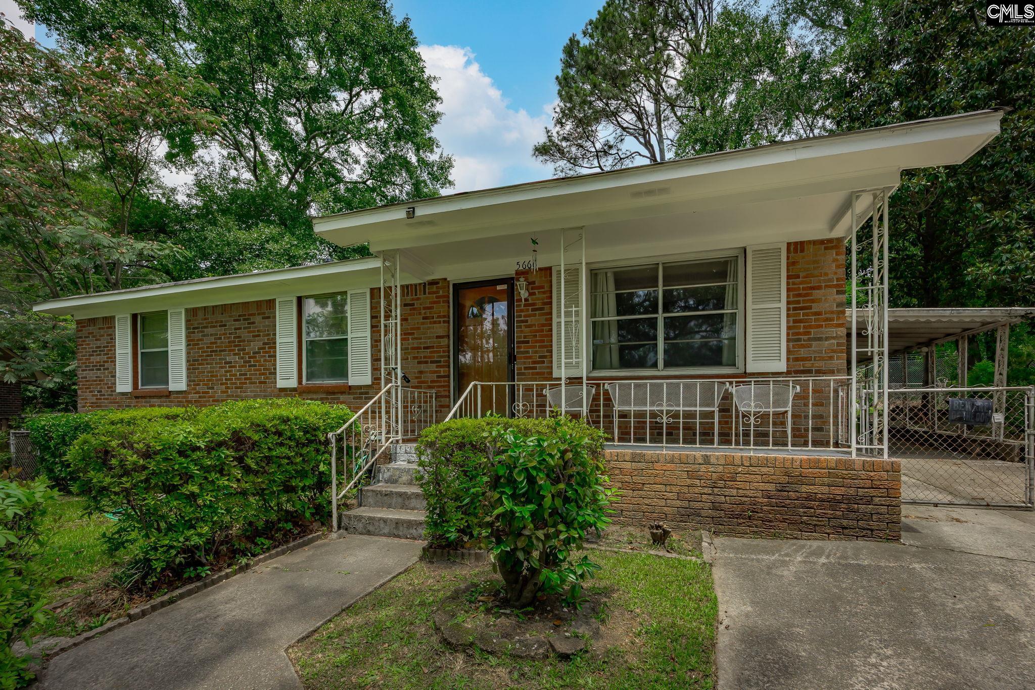 5666 Middleton Court Columbia, SC 29203 - Photo 5 of 42 a front view of a house with garden