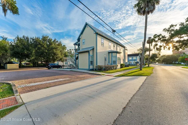a view of a house with a street