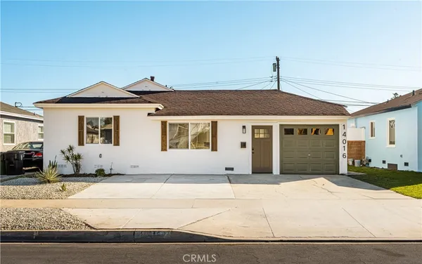 a front view of a house with a outdoor space