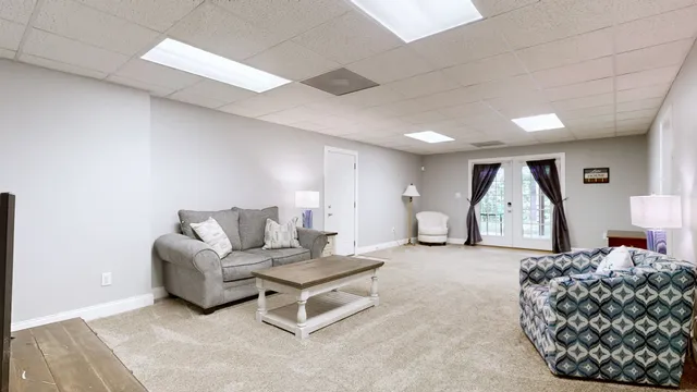 a spacious bedroom with a bed and a couch