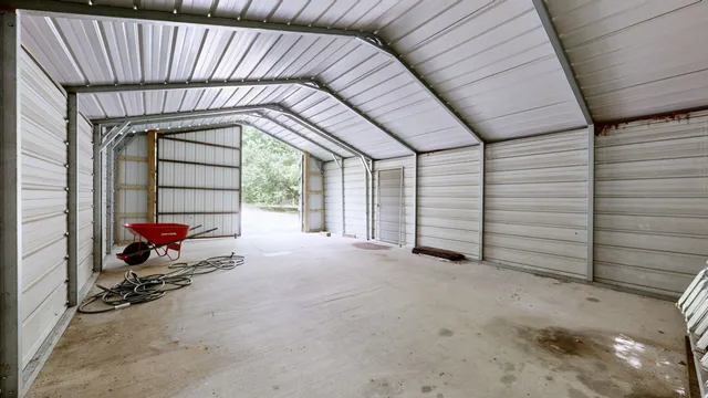 a view of a house with a bed and chair