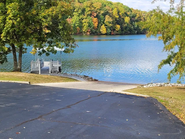 a view of a swimming pool with an outdoor space and seating area