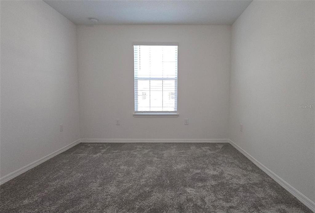 304 Woodsage Place Lake Alfred, FL 33850 - Photo 15 of 30 an empty room with a window