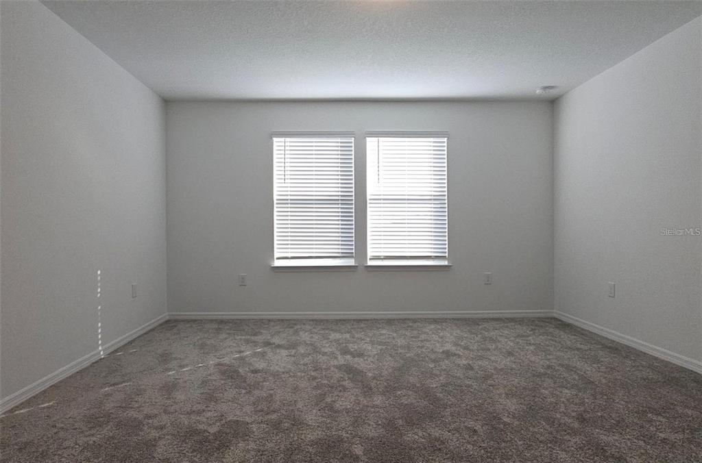 304 Woodsage Place Lake Alfred, FL 33850 - Photo 17 of 30 an empty room with a window