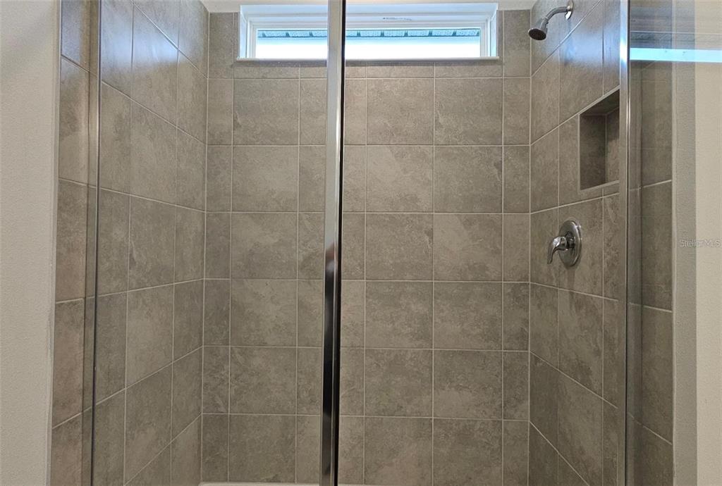 304 Woodsage Place Lake Alfred, FL 33850 - Photo 20 of 30 a bathroom with a shower