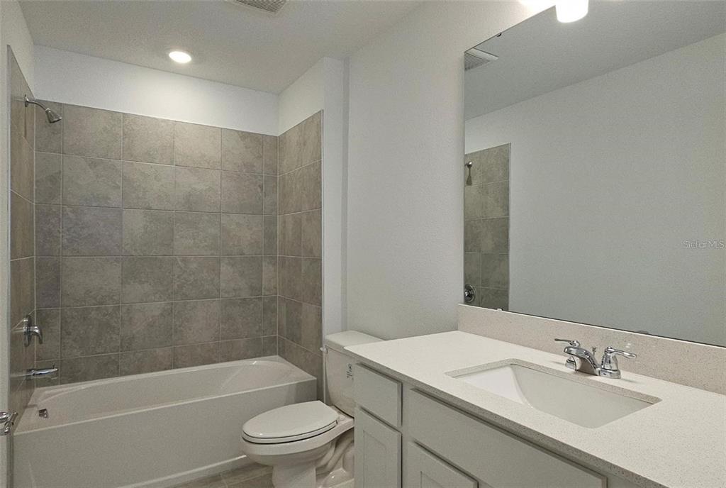 304 Woodsage Place Lake Alfred, FL 33850 - Photo 23 of 30 a bathroom with a sink a toilet and shower