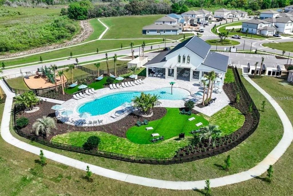 304 Woodsage Place Lake Alfred, FL 33850 - Photo 28 of 30 an aerial view of a house with a garden and lake view