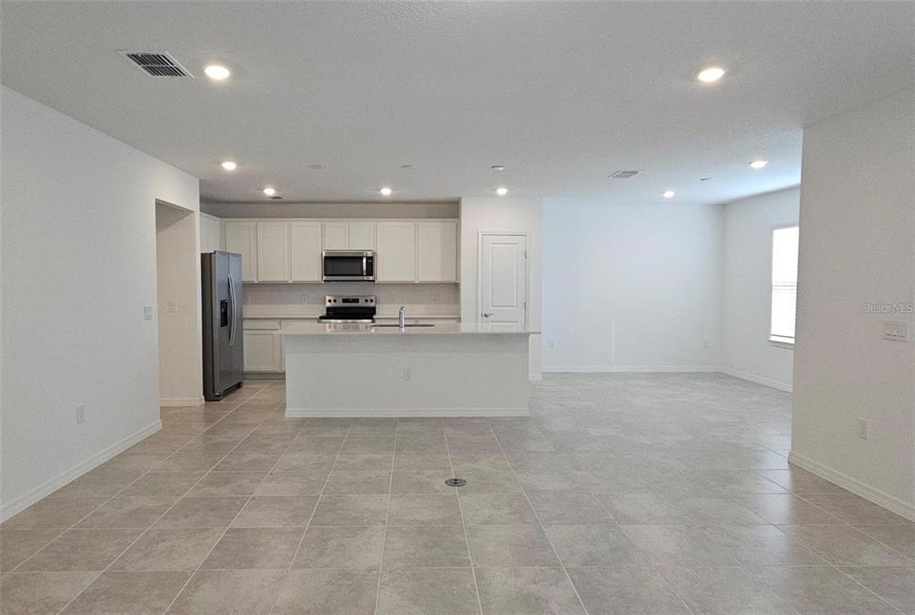 304 Woodsage Place Lake Alfred, FL 33850 - Photo 7 of 30 a view of kitchen with kitchen island sink stainless steel appliances and cabinets