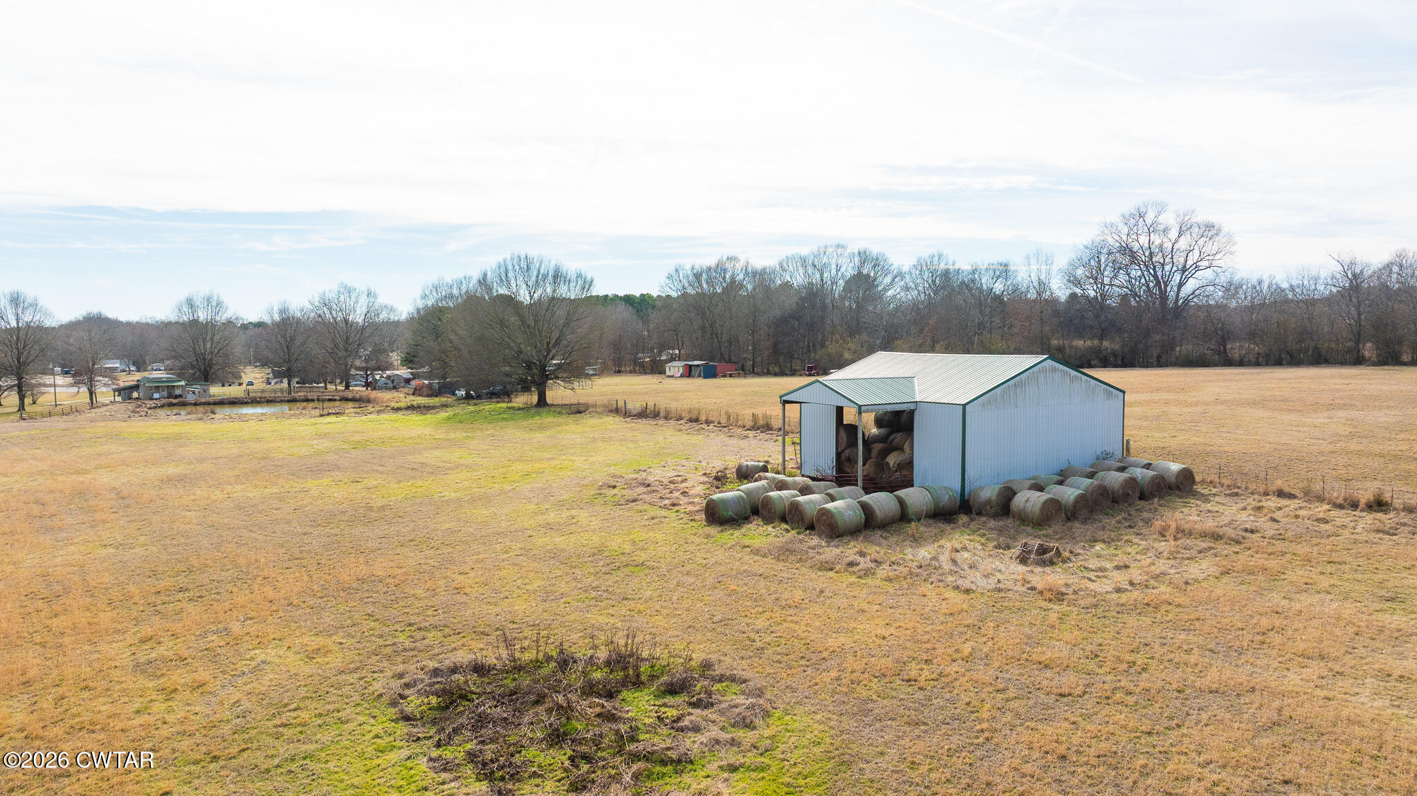 206 Hopewell Street Gleason, TN 38229 - Photo 3 of 17 a view of a lake with a big yard