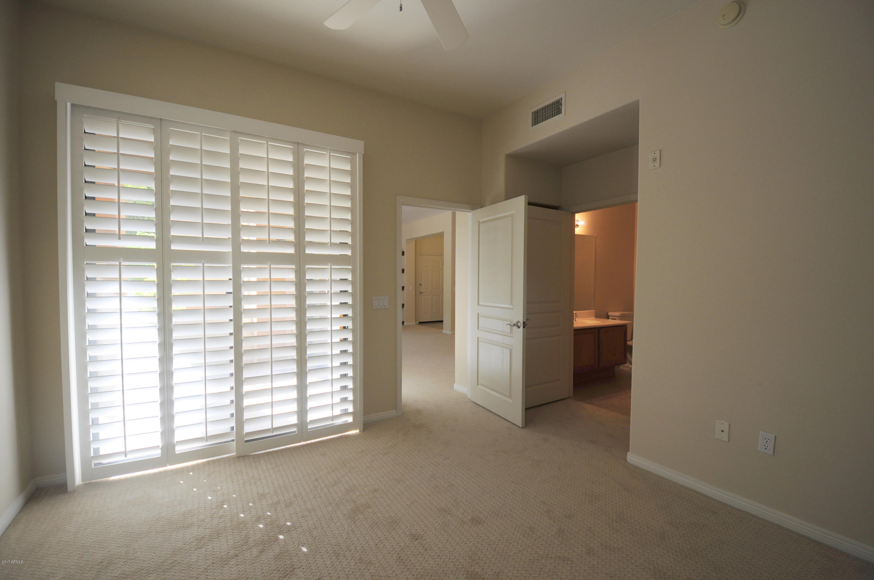 4488 East Thomas Road, Unit 1015 Phoenix, AZ 85018 - Photo 5 of 19 a view of an empty room with a window