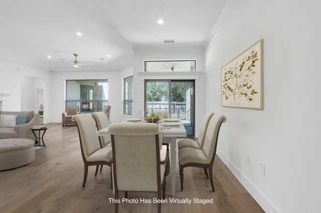 a dining room with furniture and window