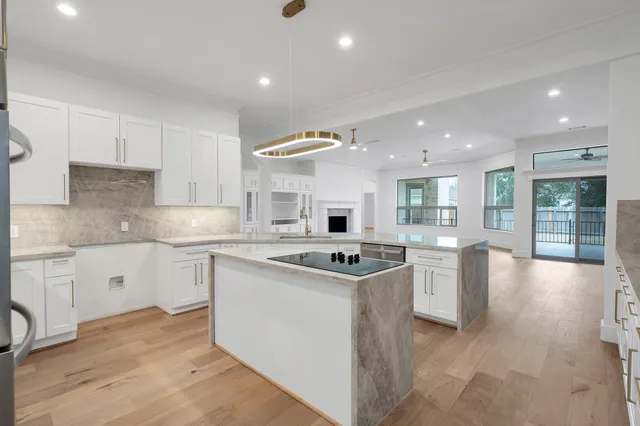 a kitchen with a sink stove and cabinets